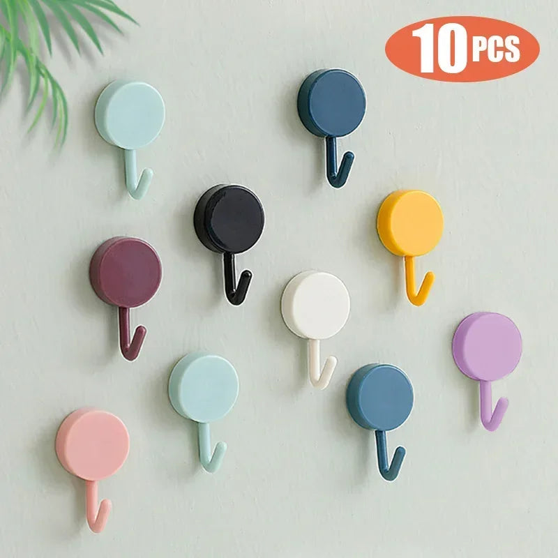 FanzyMarket 10-pack self-adhesive wall hooks for bathroom and kitchen, plastic coat towel hangers, no drill installation.