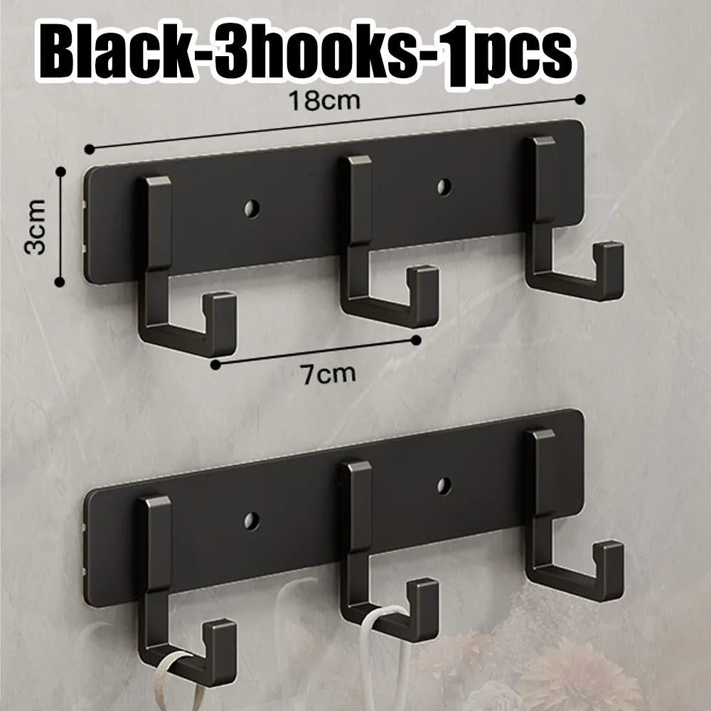 FanzyMarket stainless steel wall-mounted hook with seven adhesive hooks for towels and clothes in bathroom or kitchen organization.