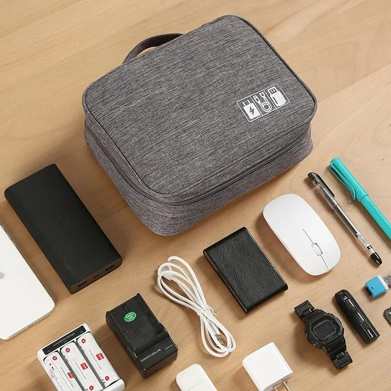 FanzyMarket large travel electronics organizer with multiple compartments for USB cables, power banks, and tech accessories.