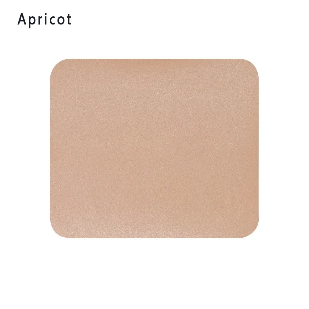 Black leather mouse pad by FanzyMarket with anti-slip bottom, waterproof surface, measuring 9.06 x 7.87 inches for gaming and office use.