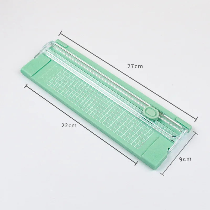 Pink FanzyMarket mini portable A4 paper trimmer for office and DIY crafts, manual plastic photo and craft cutter.