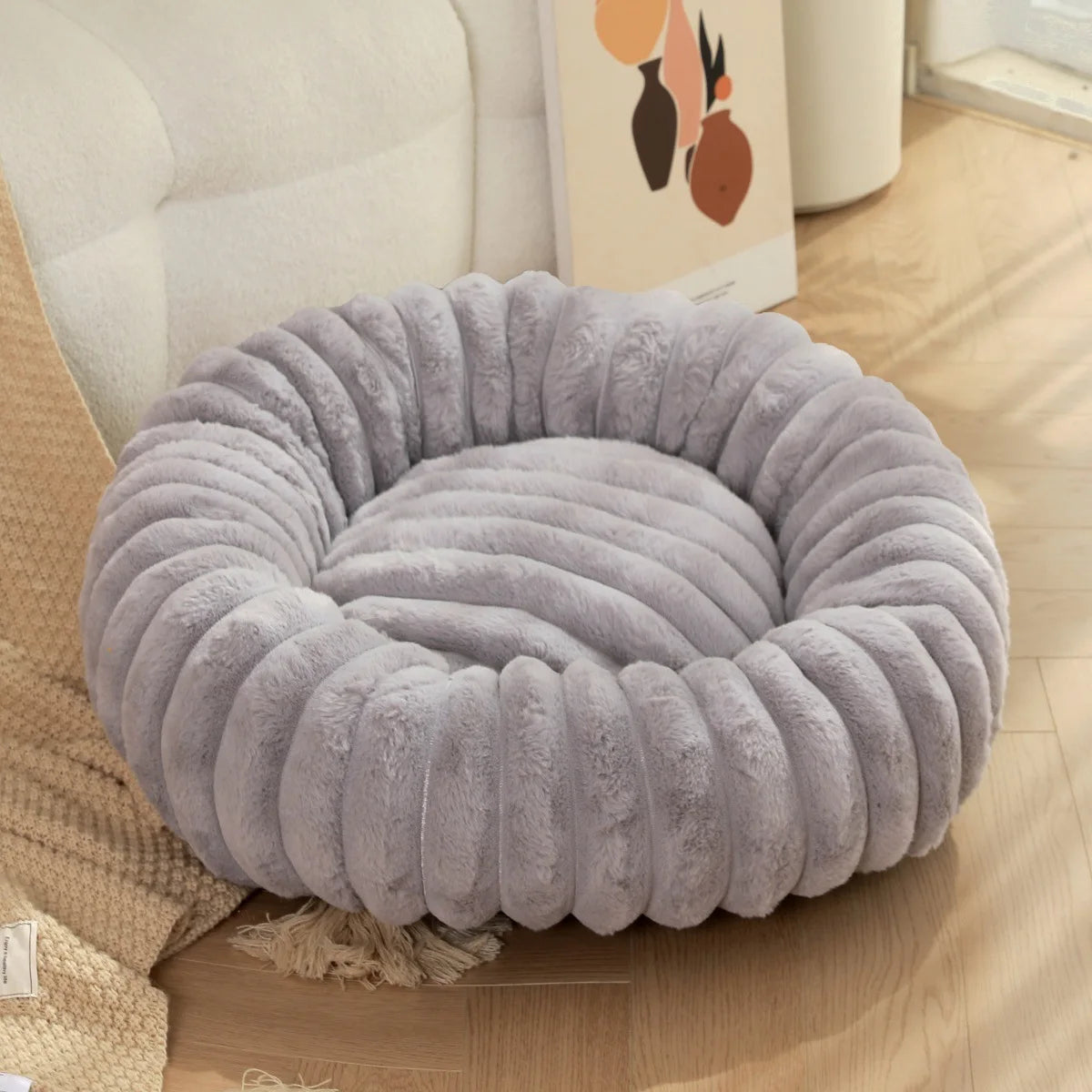 Large off-white round pet bed with washable faux fur, cozy plush surface, suitable for dogs and cats, all-season pet furniture by FanzyMarket.