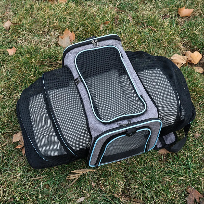 FanzyMarket foldable mesh pet carrier for cats and small dogs, soft-sided, expandable, breathable handheld tote for travel.