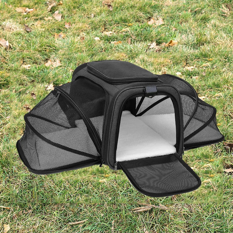 FanzyMarket foldable mesh pet carrier for cats and small dogs, soft-sided, breathable, expandable travel tote with handle.