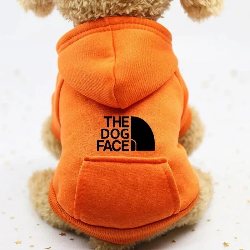 FanzyMarket autumn winter cowboy pocket pet sweater for dogs and cats, windproof sports jacket with two-leg design in orange.