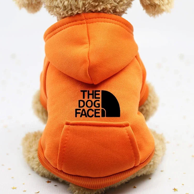 FanzyMarket autumn winter cowboy pocket pet sweater for dogs and cats, windproof sports jacket with two-leg design, orange color.