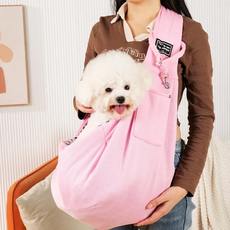 Pink pet sling carrier for small dogs and cats by FanzyMarket, portable crossbody bag holds pets up to 7.5 kg for travel.
