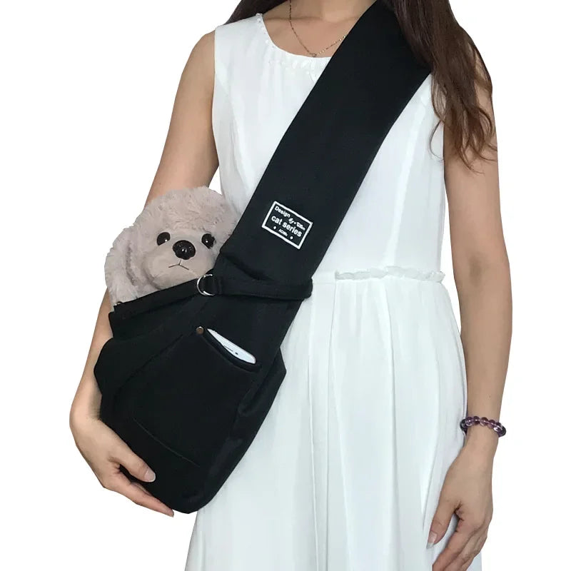 Pink pet sling carrier for small dogs and cats, FanzyMarket crossbody travel bag holding pets up to 7.5 kg, portable and comfortable.