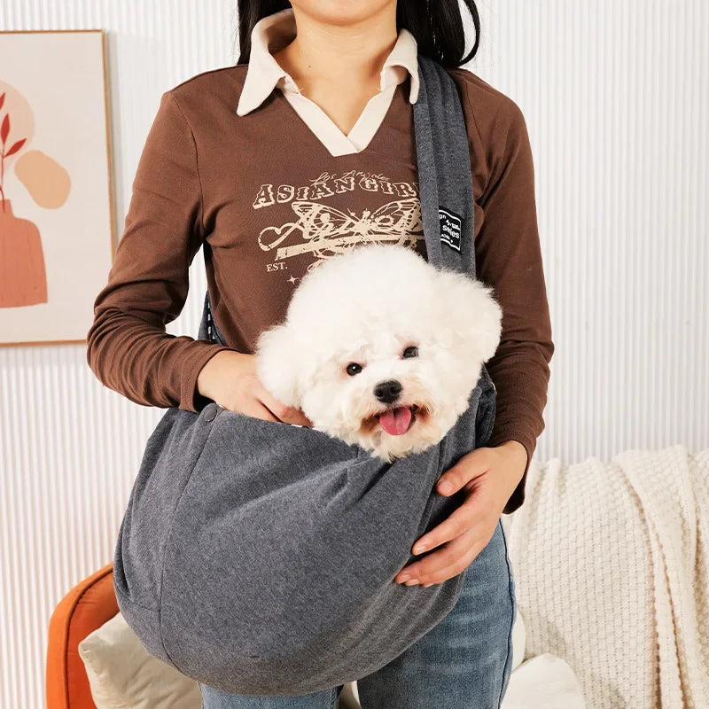Pink FanzyMarket pet sling carrier for small dogs and cats, crossbody travel bag, holds up to 7.5 kg, portable and comfortable.