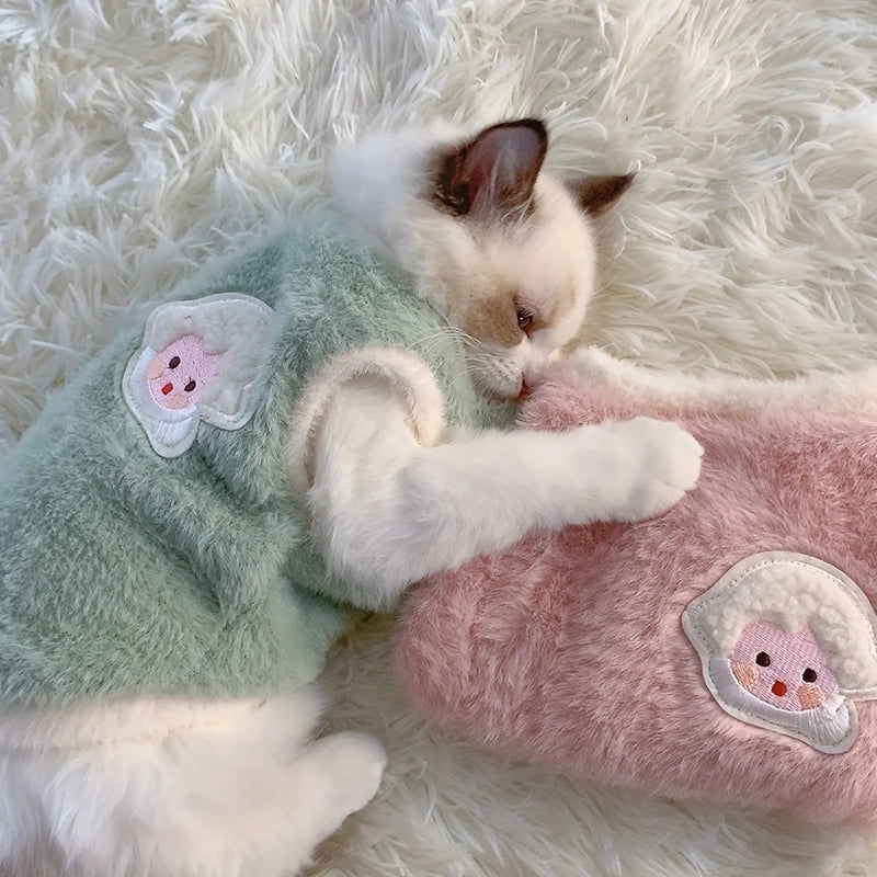 Pink warm pet sweater vest for cats and small dogs, winter pet apparel from FanzyMarket, cozy clothing for pets.