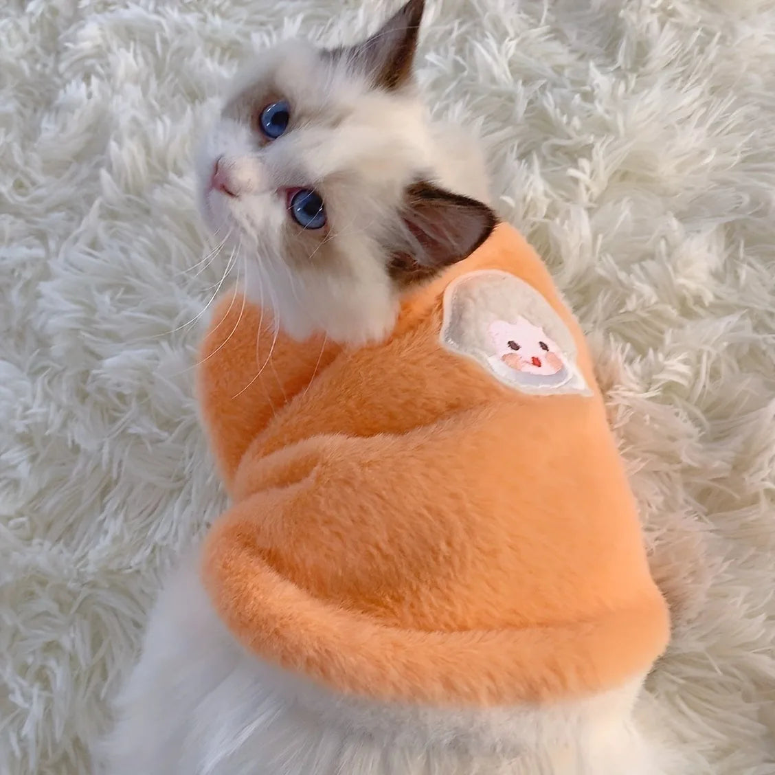 Pink warm pet sweater vest for cats and small dogs, winter pet apparel by FanzyMarket, cozy and snug for winter warmth.