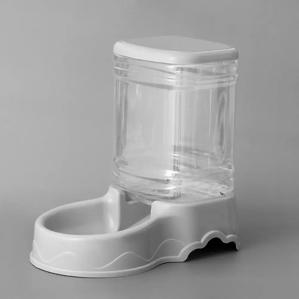 FanzyMarket automatic pet feeder and water fountain for cats and dogs, 3.8L pink plastic food and water dispenser.