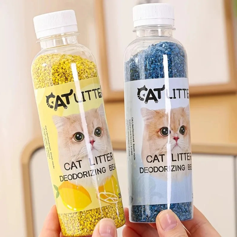 FanzyMarket cat litter deodorizer beads bottle with green packaging, odor eliminator and litter box freshener for pet hygiene.