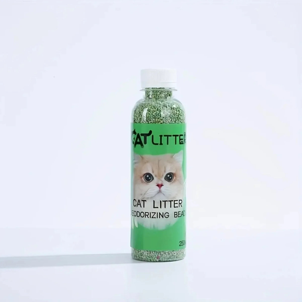 FanzyMarket cat litter deodorizer beads bottle, odor eliminator and freshener for litter boxes, green plastic container.