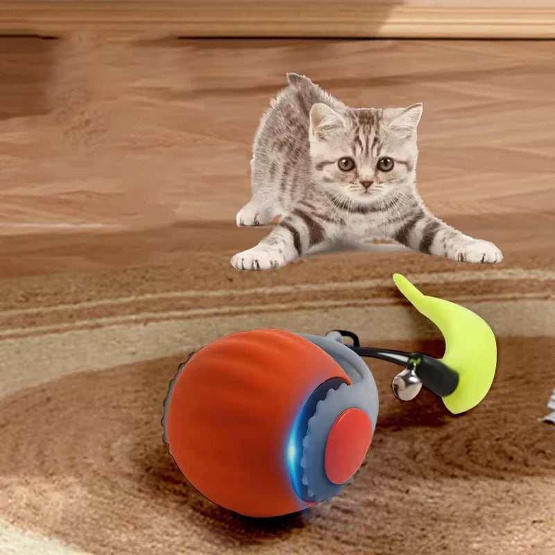 Grey rechargeable interactive rolling cat toy with faux tail, motion-activated ball for cats and small dogs by FanzyMarket.