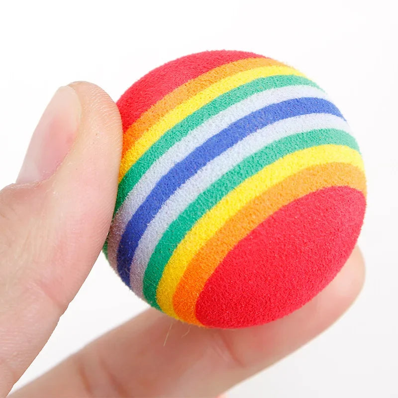 Set of 10 rainbow rubber interactive pet balls for cats and dogs, featuring rattles and chew-friendly designs for play and training.