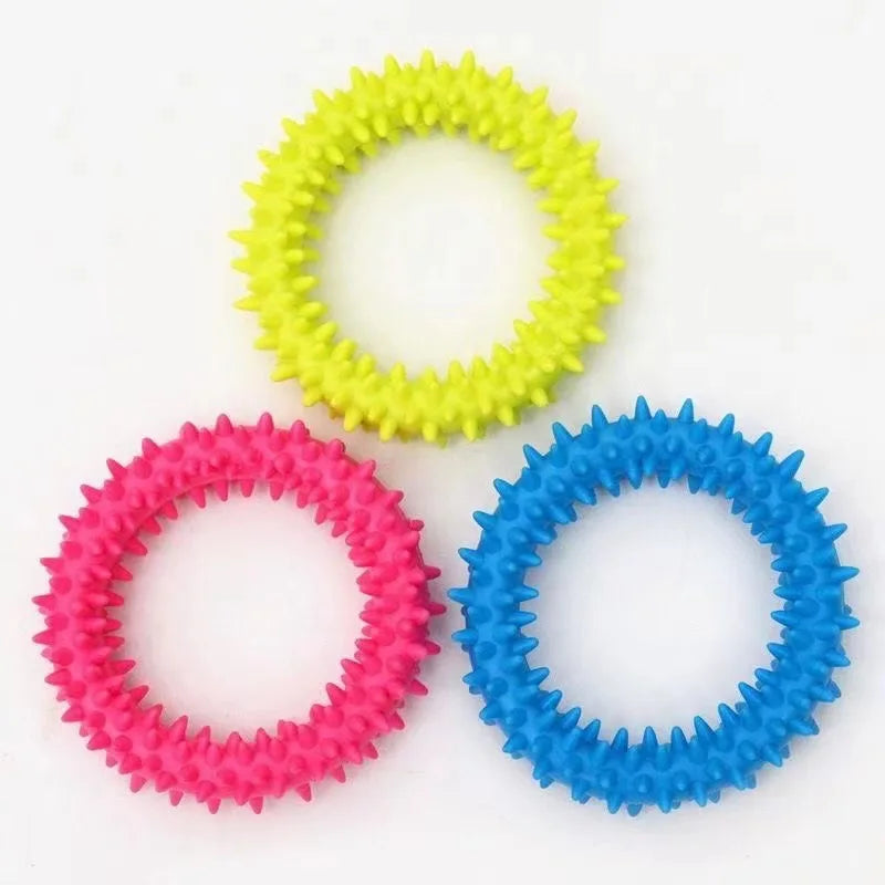 FanzyMarket bite-resistant rubber spiked dog chew toy for small dogs with squeaker, designed for teeth cleaning and training.