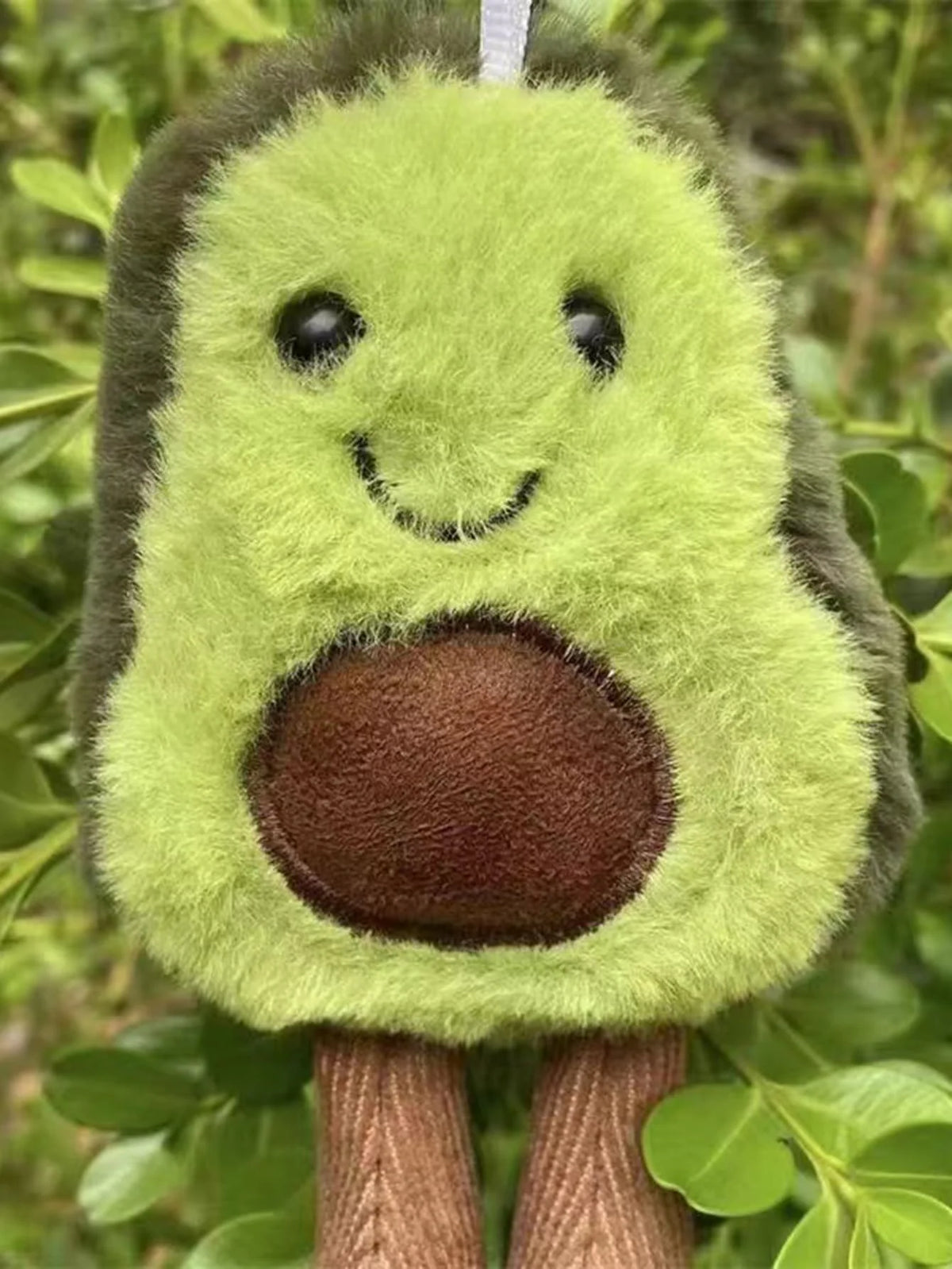 FanzyMarket plush avocado dog toy made of soft fleece, ideal as a cuddly companion for small and medium dogs.