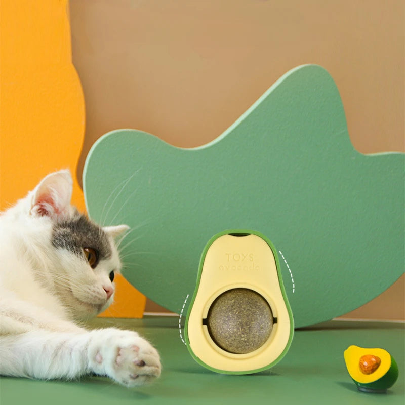FanzyMarket rotating stick-on catnip ball toy with avocado design, promoting licking and teeth cleaning for cats, 6 x 4.6 cm