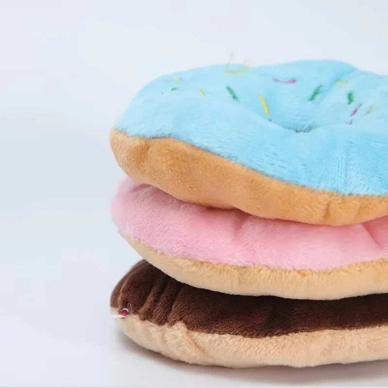 Pink plush donut chew toy with squeaker for small and medium dogs, 4.3 inches, soft fleece material by FanzyMarket.