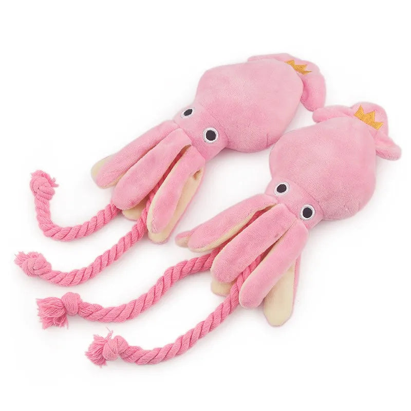 Pink plush octopus dog chew toy with squeaker and rope, small size, ideal for dental cleaning for dogs and cats.