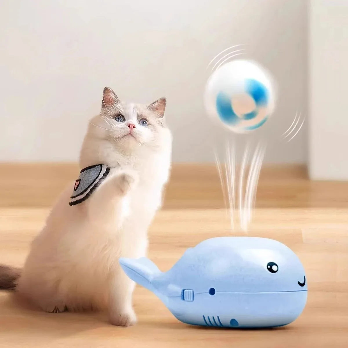 Pink whale-shaped electric floating cat toy with USB rechargeable fan, portable design, suitable for pet play and entertainment.