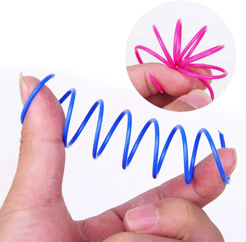 FanzyMarket bouncy spring cat toy made of elastic plastic coil, 2.17 inches, designed for cats and kittens to play and chase.