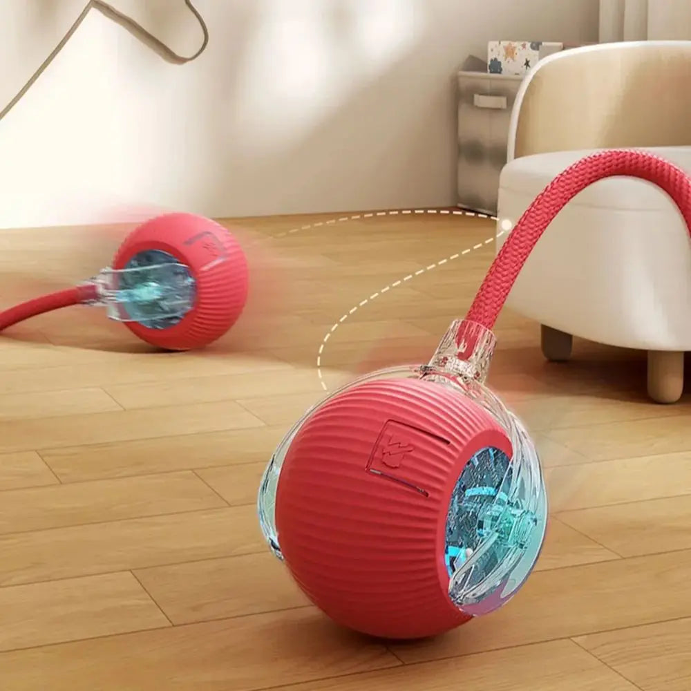 Red plush interactive rechargeable rolling cat ball with faux tail, designed for cats and small dogs as a smart pet toy.