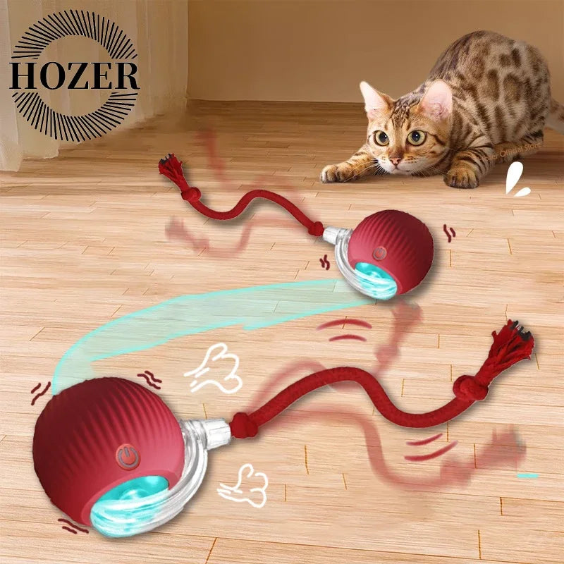 Two rechargeable green interactive rolling cat ball toys with faux tails, designed for playful feline engagement.
