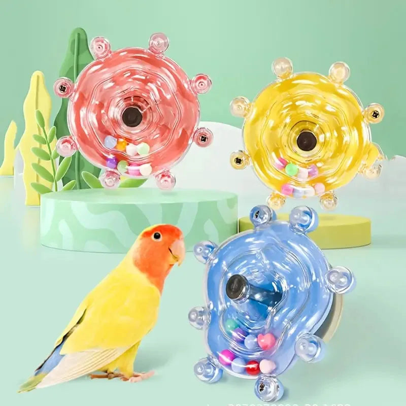 FanzyMarket interactive rotating treat dispenser parrot toy for mental stimulation and cage entertainment, transparent design.