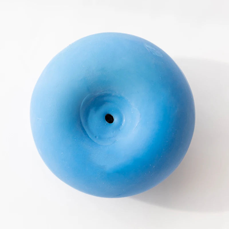 FanzyMarket dog squeaky chew ball made of bite-resistant rubber, designed for dental cleaning and playful chewing.