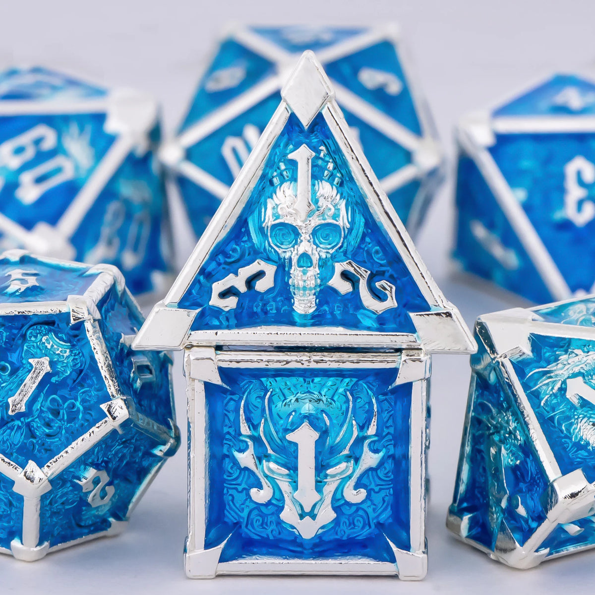 FanzyMarket skull and dragon metal dice set with seven polyhedral D&D dice for tabletop RPG gaming, featuring detailed designs.
