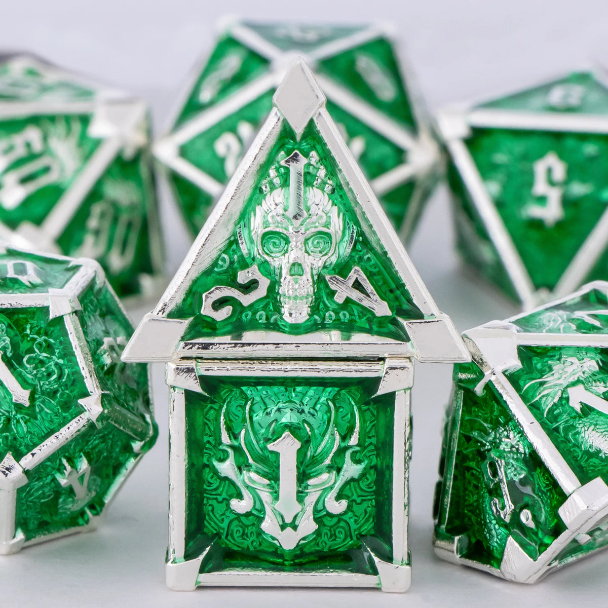 FanzyMarket skull and dragon metal dice set with seven polyhedral DnD dice for tabletop RPG gaming.