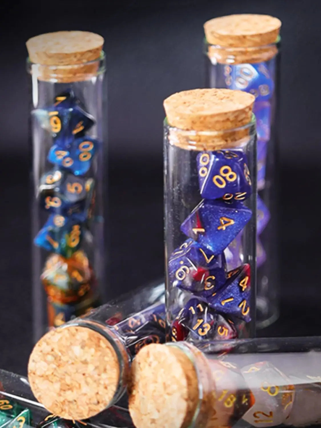Transparent purple and dark blue 7-piece polyhedral RPG dice set in potion flask style by FanzyMarket for D&D and tabletop games.