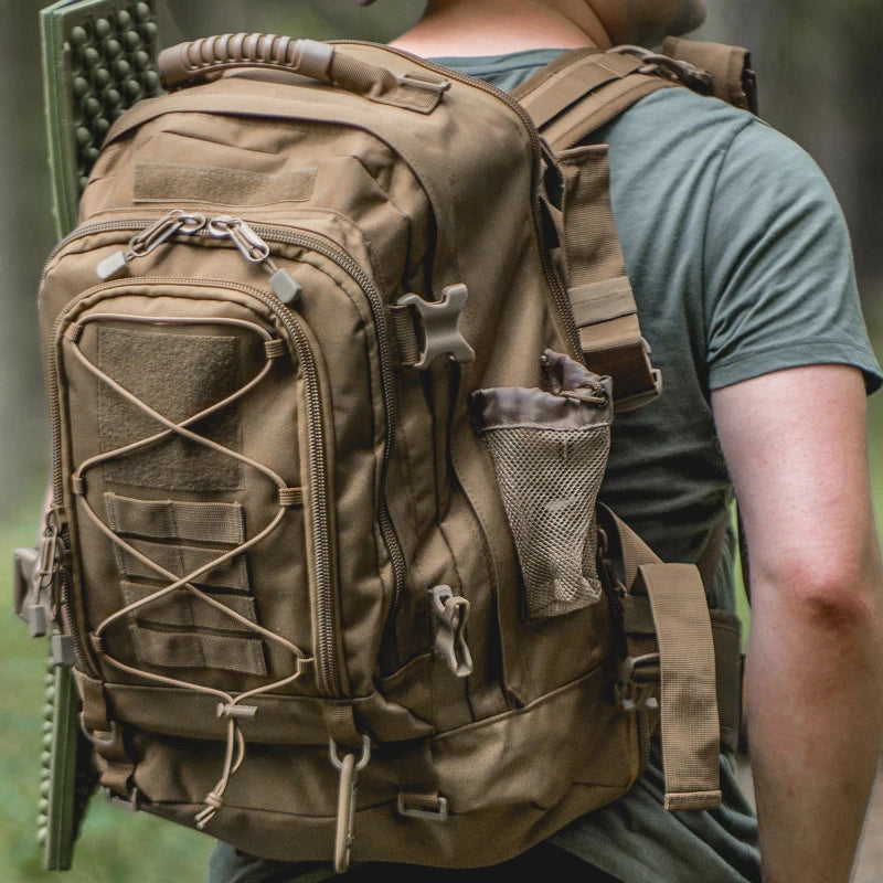 Brown expandable 40-65L tactical backpack by FanzyMarket with Molle system, water-resistant camping and hiking rucksack for outdoor adventures.