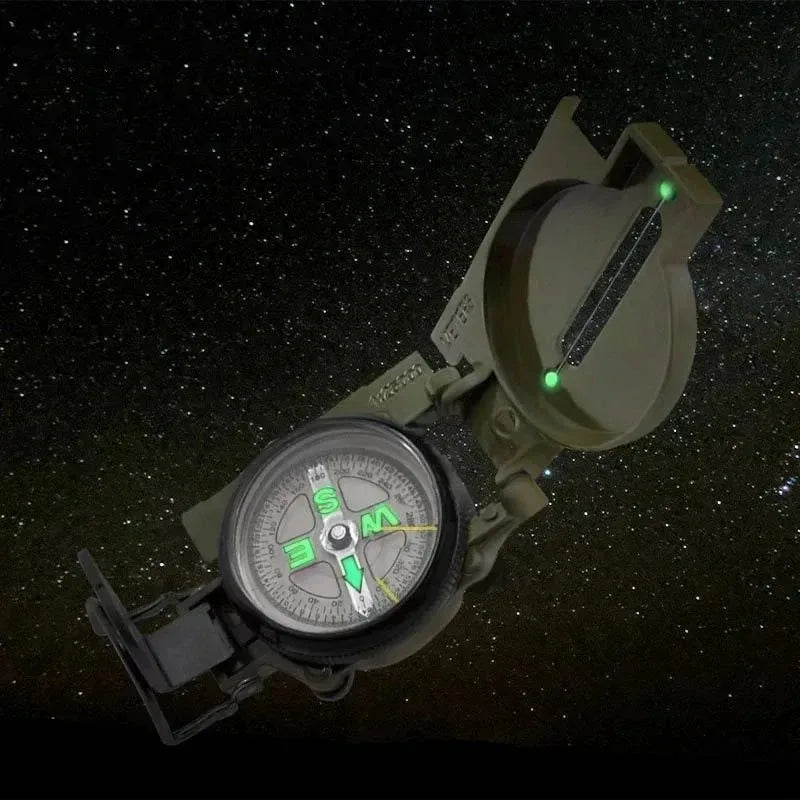 Green waterproof metal sighting compass by FanzyMarket for hiking, mountaineering, and outdoor survival activities.
