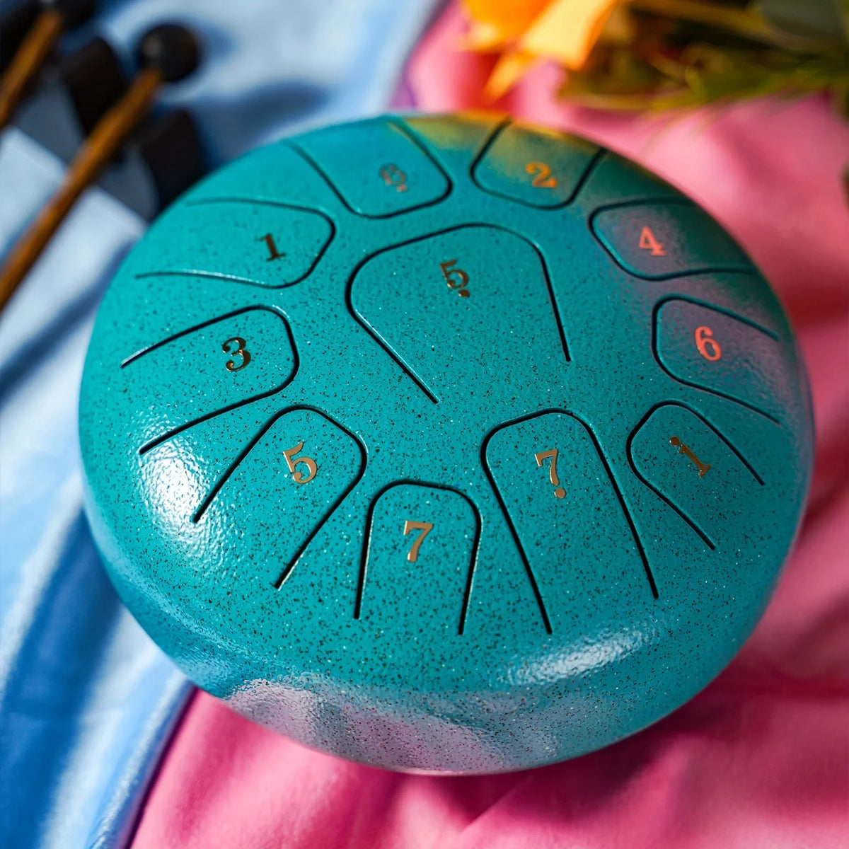 Navy blue 6-inch FanzyMarket steel tongue drum set with 11 notes, sticks, and carry bag for sound healing, yoga, and meditation.