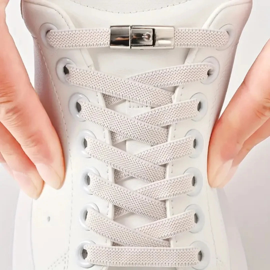 White no-tie elastic shoelaces with press lock on sneaker