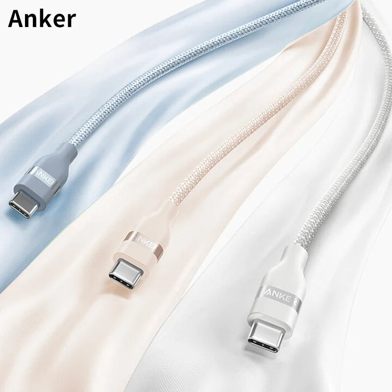 Three USB-C cables in different colors on a soft background