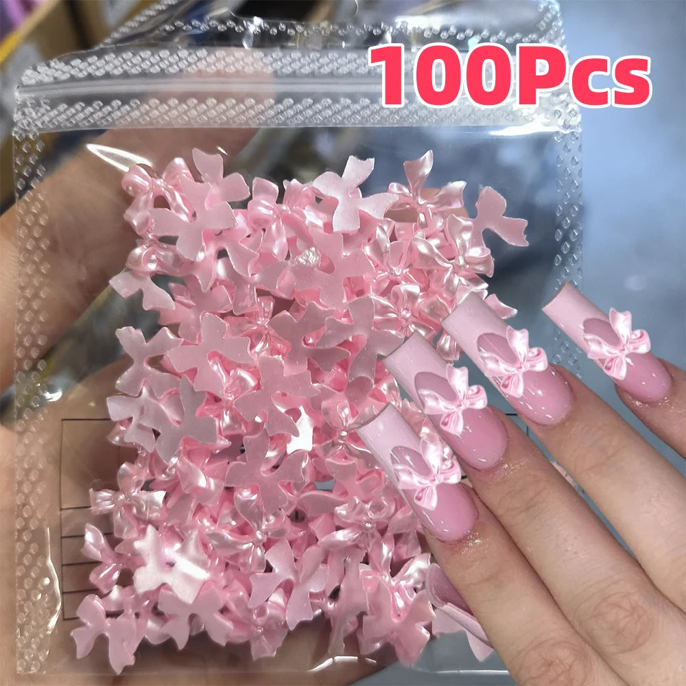 100-Pack 3D Pink Pearlescent Resin Bow Nail Charms — Flat Back Bowknot Nail Art Decorations for DIY Manicure