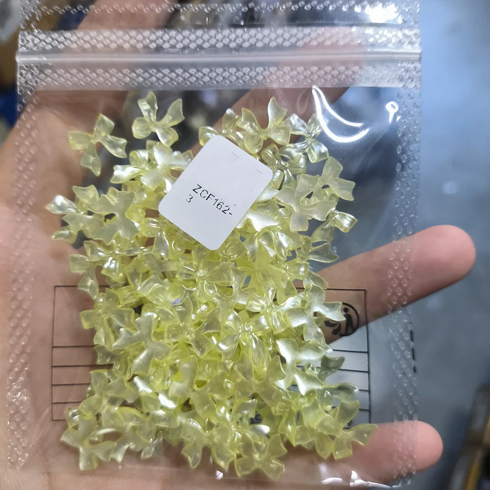 100-Pack 3D Pink Pearlescent Resin Bow Nail Charms — Flat Back Bowknot Nail Art Decorations for DIY Manicure