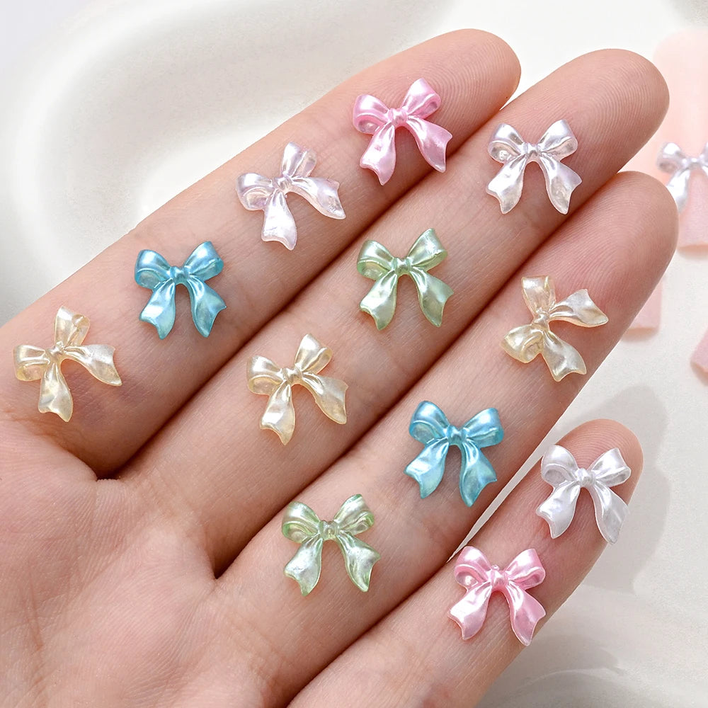 100-Pack 3D Pink Pearlescent Resin Bow Nail Charms — Flat Back Bowknot Nail Art Decorations for DIY Manicure