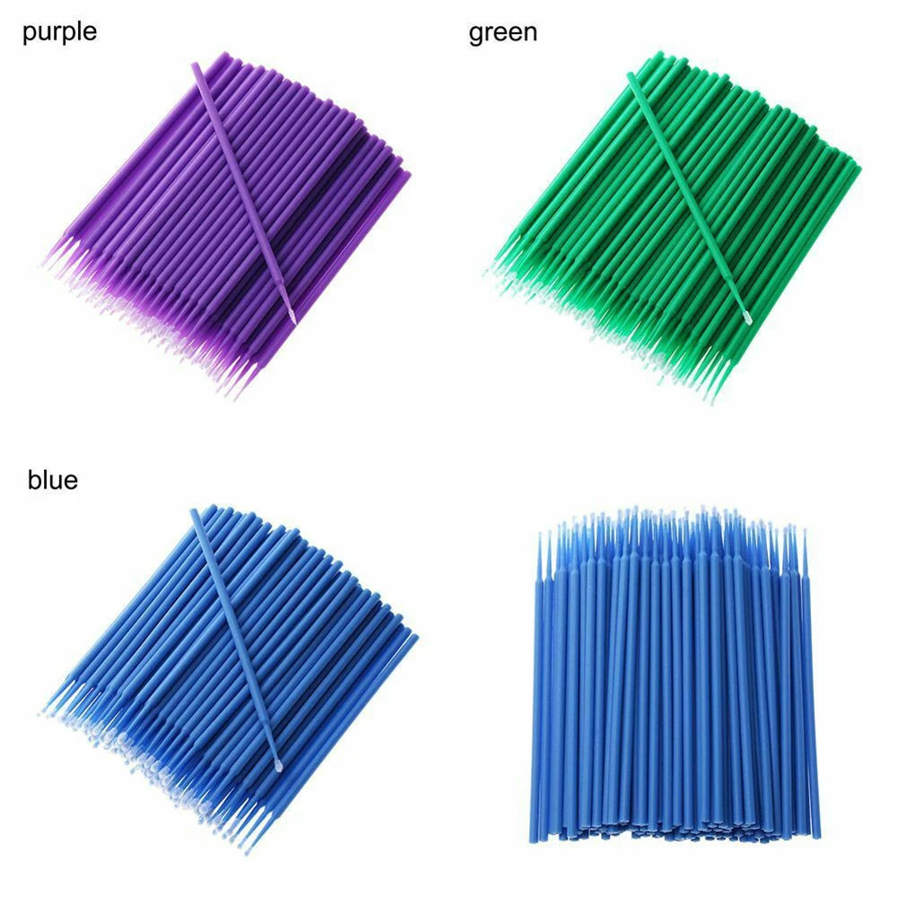 Assorted colors of disposable micro paint brushes including purple, green, and blue