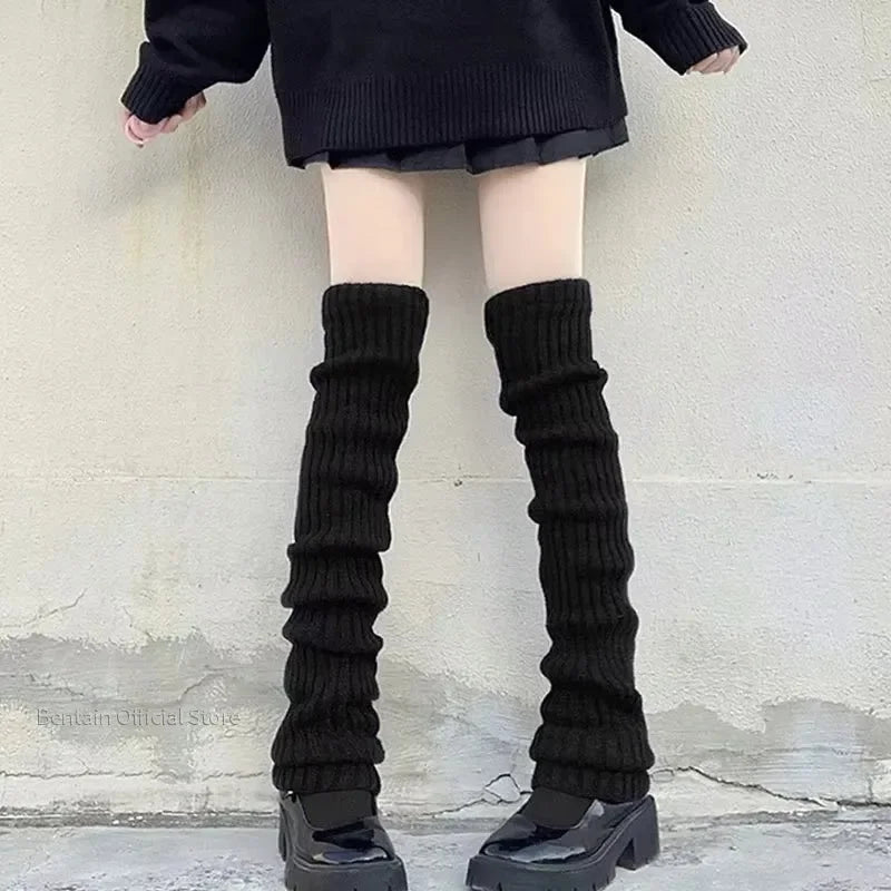 Pair of black and white Y2K knit leg warmers with crochet design, 50cm length, from FanzyMarket, perfect as trendy boot cuffs.