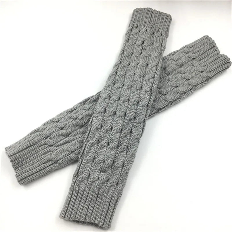 Black and white women's knit leg warmers, 40 cm long crochet boot cuffs for autumn and winter, from FanzyMarket.