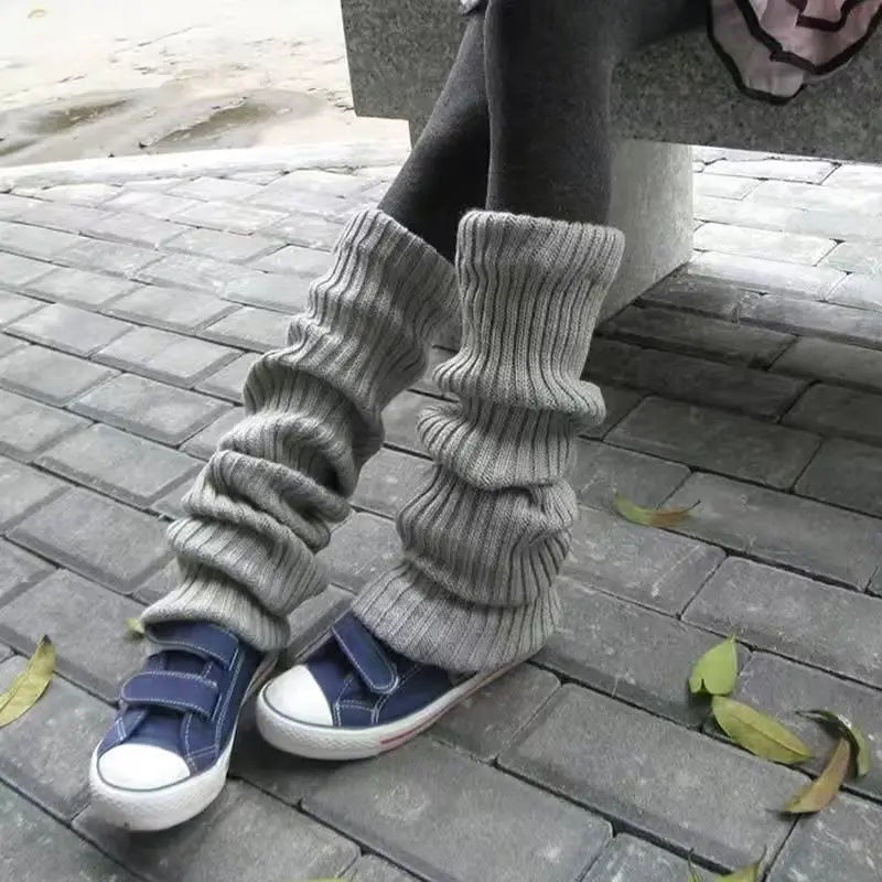 Pair of FanzyMarket knit bubble leg warmers in black, Y2K punk gothic style, 40/50/70 cm crochet boot cuffs for leg warmth and fashion.