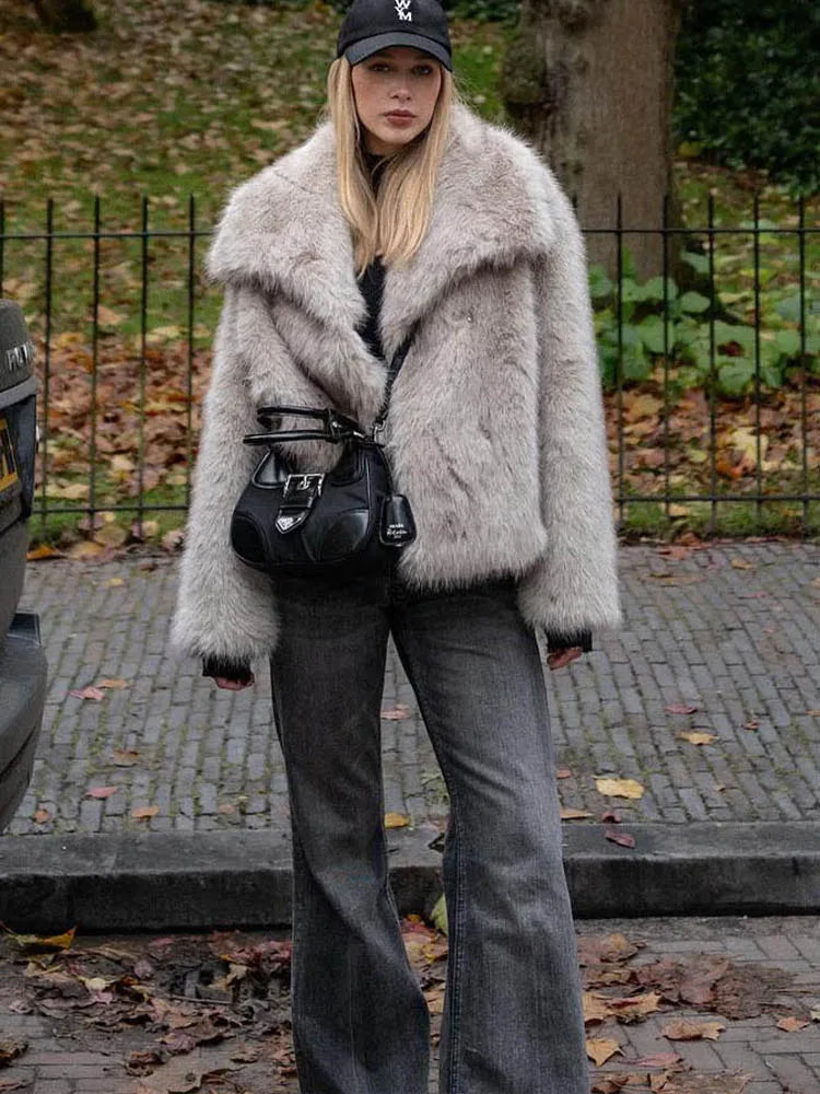 White cropped faux fur jacket for women by FanzyMarket, featuring long sleeves, snap buttons, lapel collar, ideal for winter.