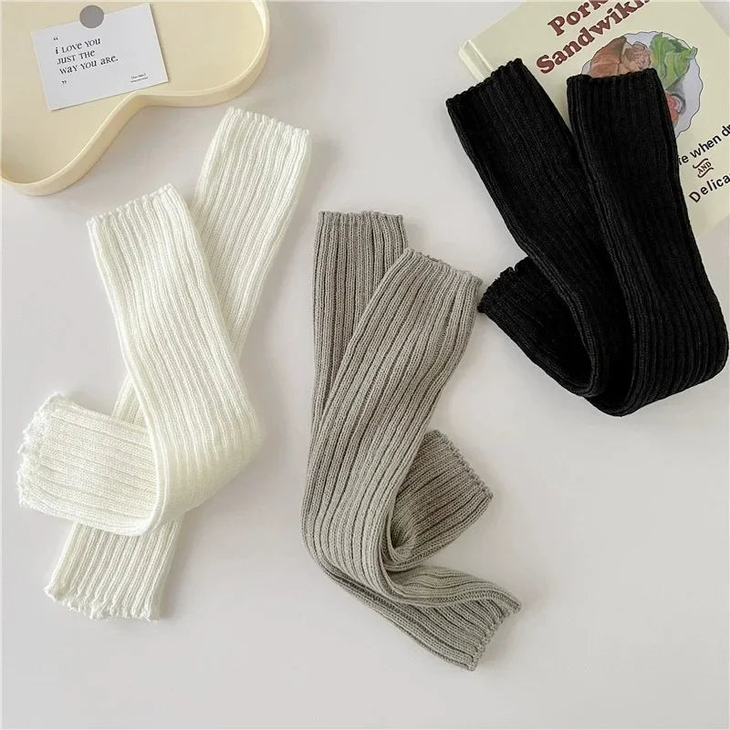 Pair of white women's knit acrylic leg warmers with crochet design, 40cm long boot cuffs for Japanese Lolita style.