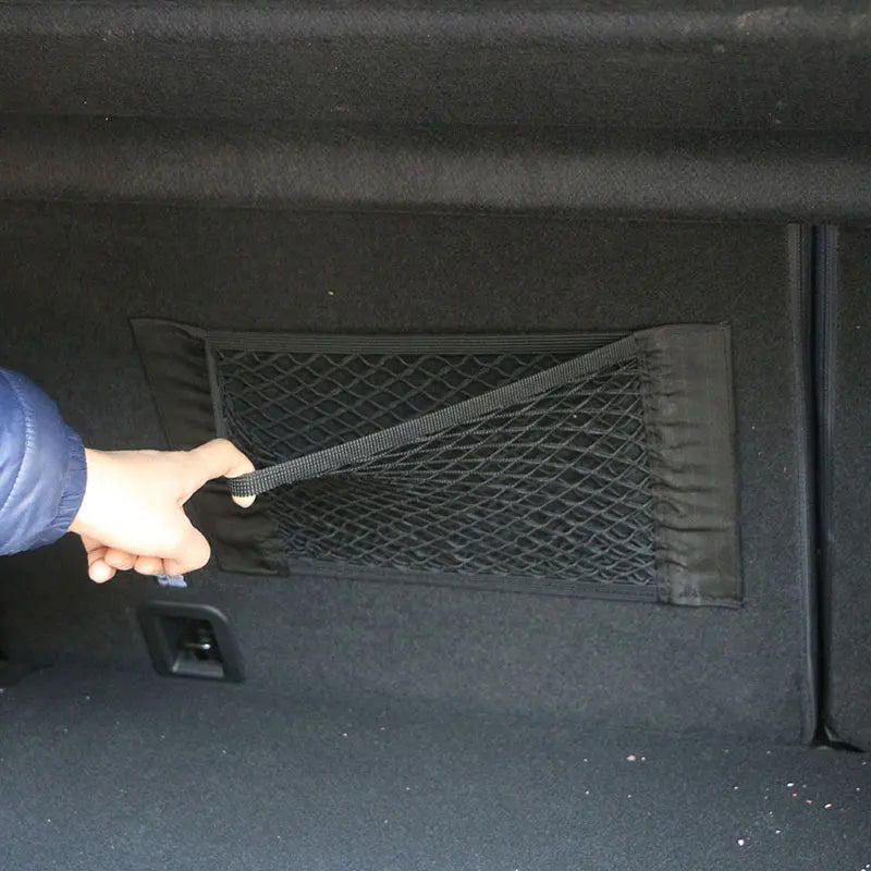 FanzyMarket car trunk storage mesh net bag, 40×20 cm, adhesive elastic organizer for auto interior and phone mounts.