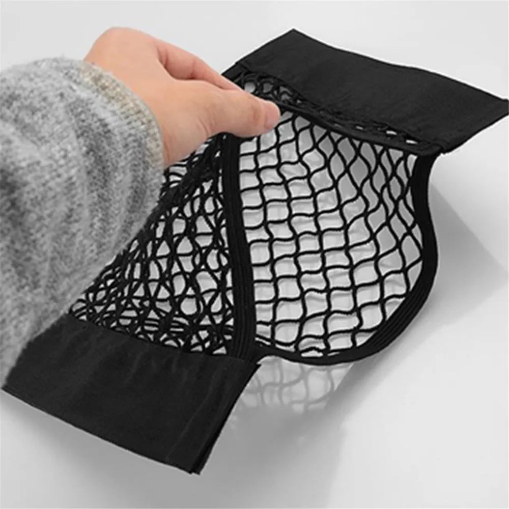 FanzyMarket car trunk storage mesh net bag, 40x20 cm, adhesive elastic organizer for vehicle interior and trunk organization.